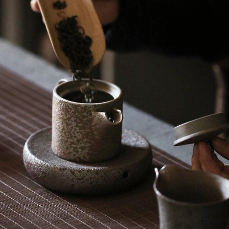 full side view of rustic iron rust glaze ceramic tea pot