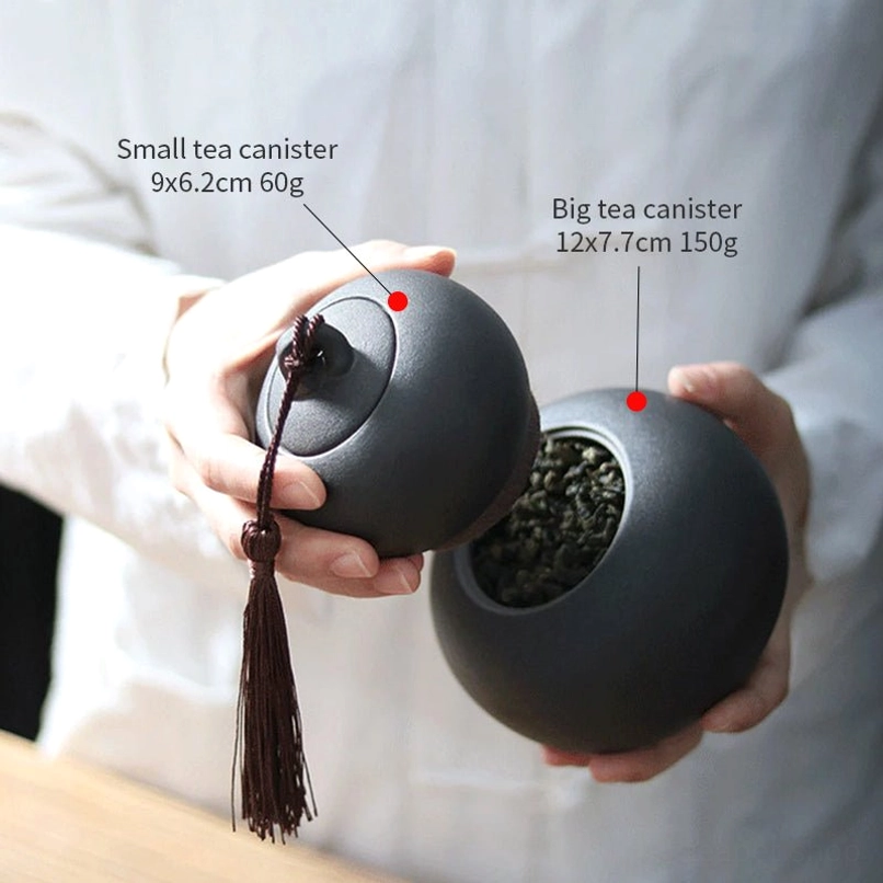 two separate ceramic gourd tea canisters side by side