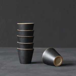 set of 6 vintage black ceramic japanese tea cups stacked to show space saving design