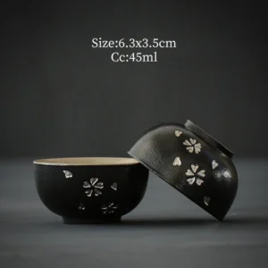 set of two handcrafted antique black ceramic chawan tea bowls with silver sakura inlay