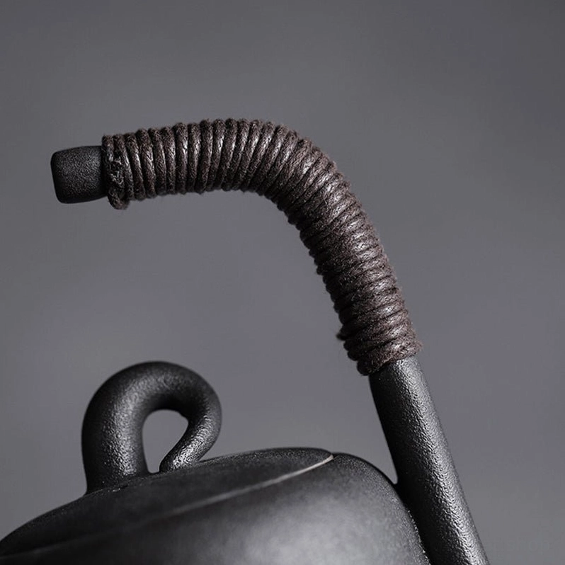 Profile view of 180ml wrapped handle ceramic teapot showing spout shape