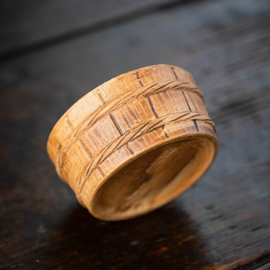 side profile of zisha gourd loose leaf tea strainer on holder