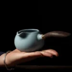 full side view of 200ml sky blue ru kiln gong dao bei with wooden handle