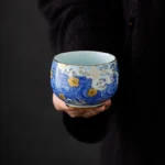 Handcrafted starry sky chawan tea bowl full product view with blue wave and cloud motifs