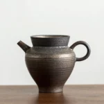 Style A rustic iron glazed coarse pottery Gong Dao Bei tea fairness pitcher front view