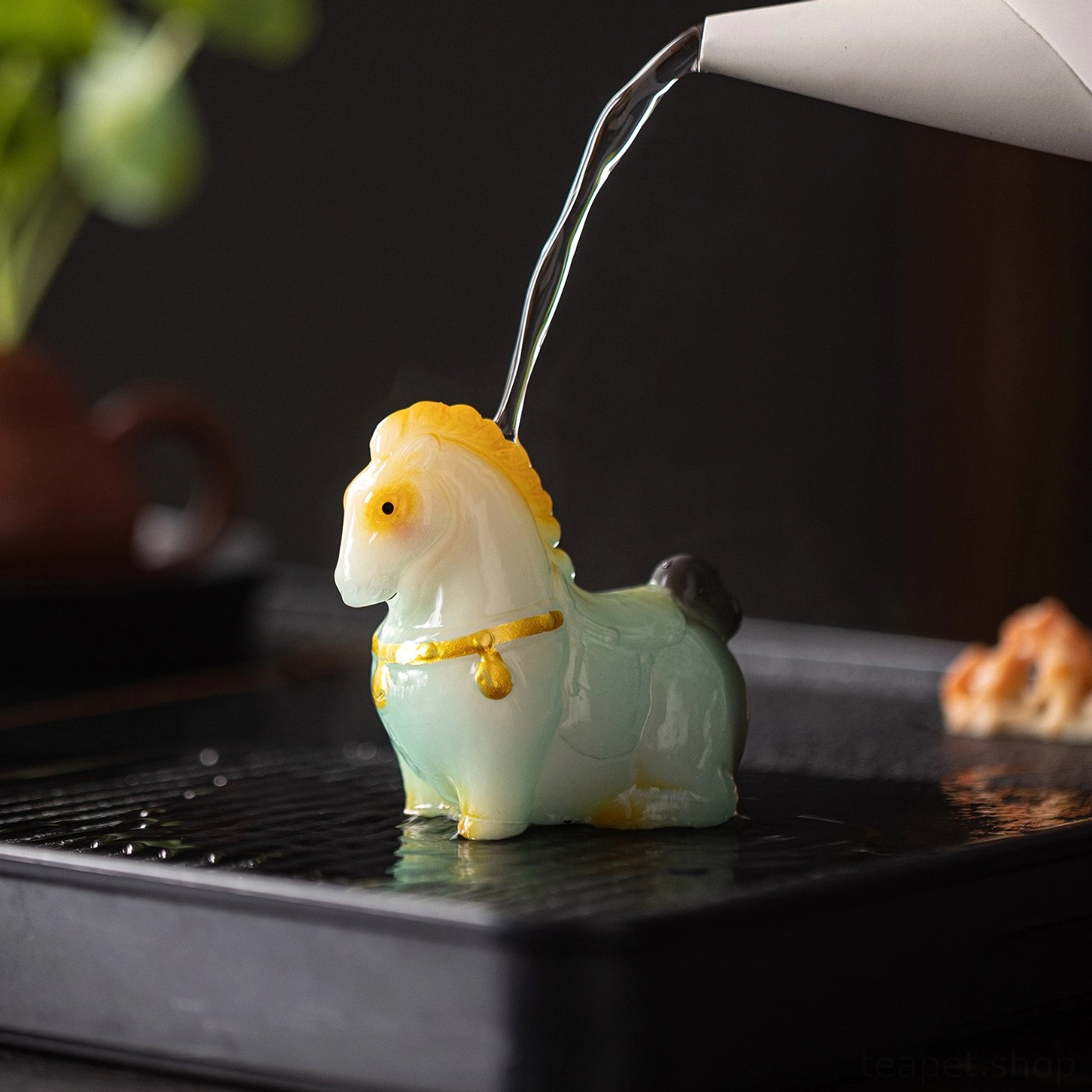 tang style handcrafted color changing horse tea pet on wooden tea table