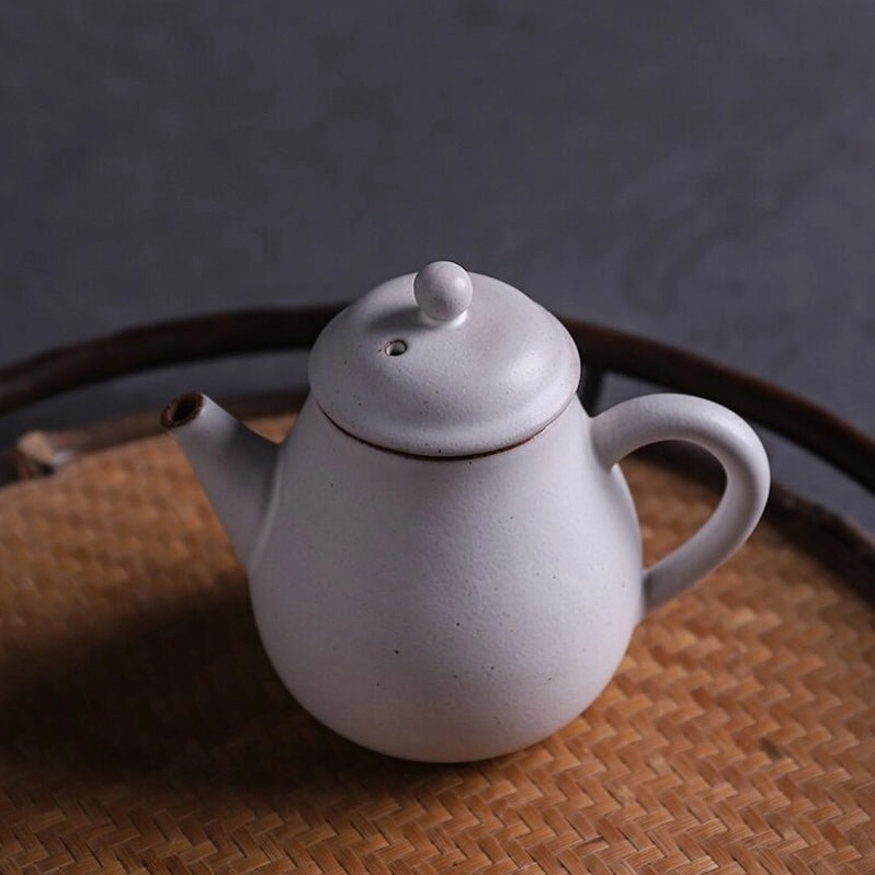 top view of lid and opening of handcrafted small white teapot