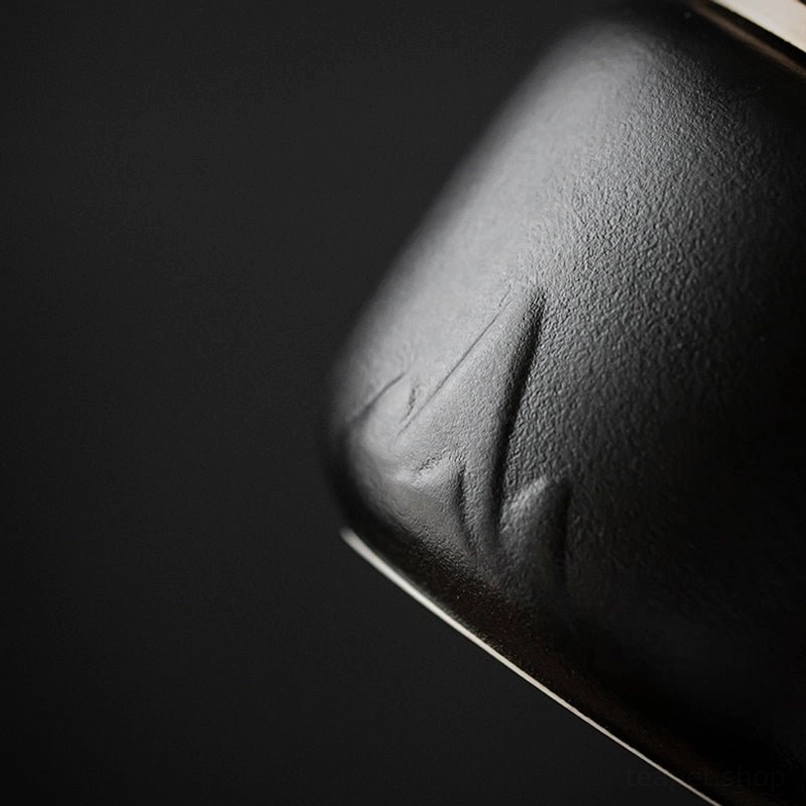 Top view of sealed metal lid on the ceramic tea storage jar