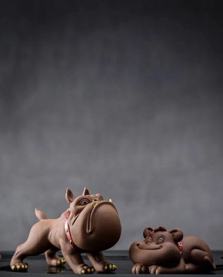 Full two-piece French bulldog tea pet set showing standing and lying designs