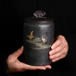 vintage black ceramic crane tea jar full view