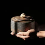 full view of vintage bronze embossed ceramic sealed chinese tea jar