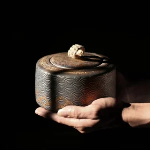 full view of vintage bronze embossed ceramic sealed chinese tea jar