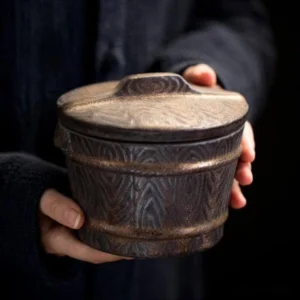 front view of vintage barrel style ceramic tea jar for loose tea storage