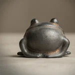 vintage gilded glaze ceramic frog tea pet as teapot lid rest on tea tray