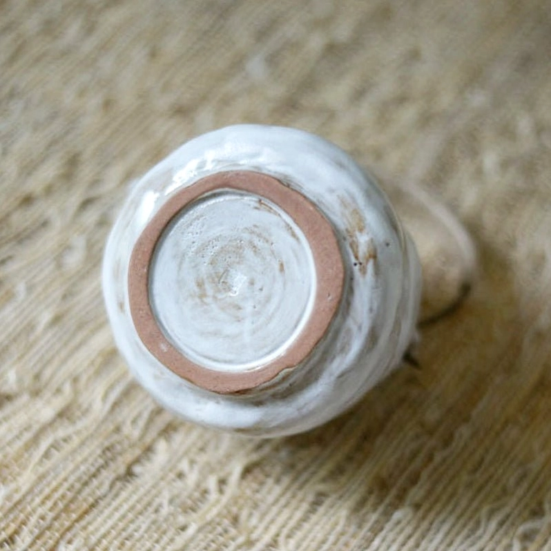 wabi-sabi ceramic tea pot top down view showing spout and lid