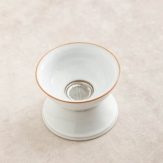 white ceramic loose leaf tea strainer with gold trim