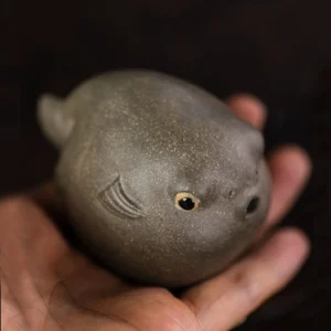 handmade yixing purple clay puffer fish tea pet main view on wooden tea table