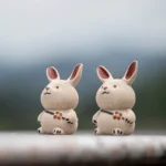 Set of 2 handcrafted Yixing clay rabbit tea pets with carrot backpacks main view