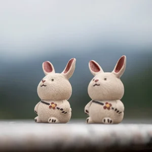 Set of 2 handcrafted Yixing clay rabbit tea pets with carrot backpacks main view