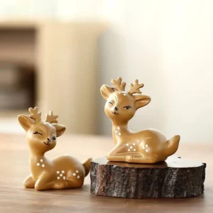 Main front view of handcrafted Yixing winking sika deer purple clay tea pet