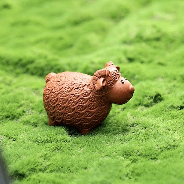 handmade yixing zisha money sheep tea pet close up of face details